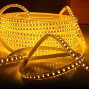 Warm LED strip light roll emitting bright decorative lighting, ideal for indoor and accent lighting.